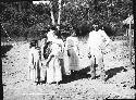 Family in front of hut