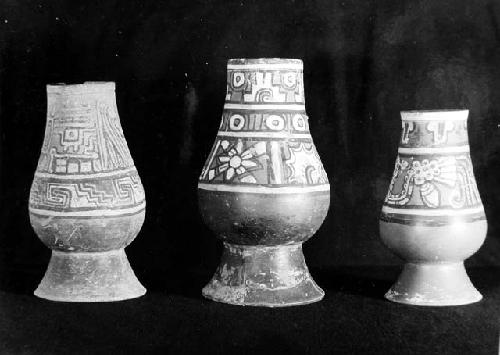 3 Polychrome Fine Orange tapered vases with pedestal bases.