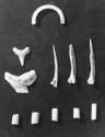 Misc. bone & tooth I-K.  53-158: bone ring; 55-267; 55-231; 54-235: fish tooth