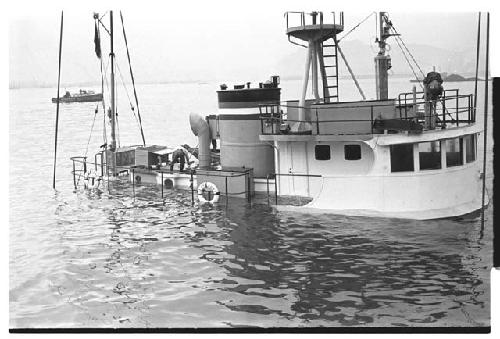 Partially submerged U.S. Army tugboat