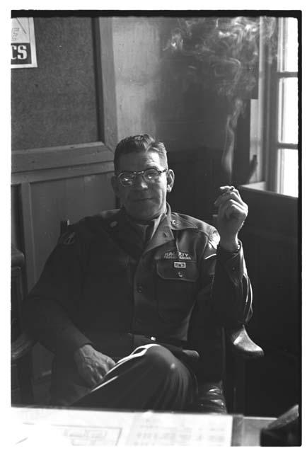 Colonel Hagerty posing with cigarette