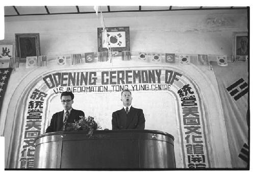 Men at podium at U.S. Information Centre, Tong Yung