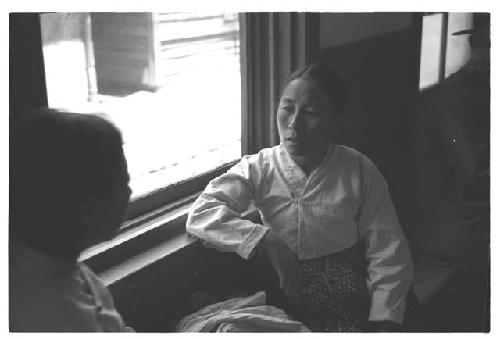 Two woman near window