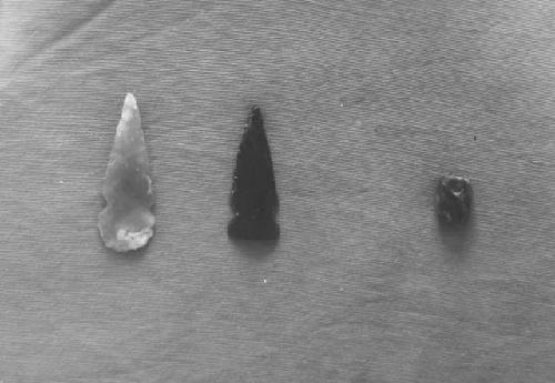 Arrow heads (cat 54-130, 54-131) and jade bead (cat. 54-59)