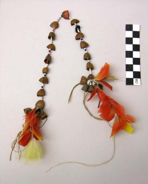 Feather, bead and seed ornament