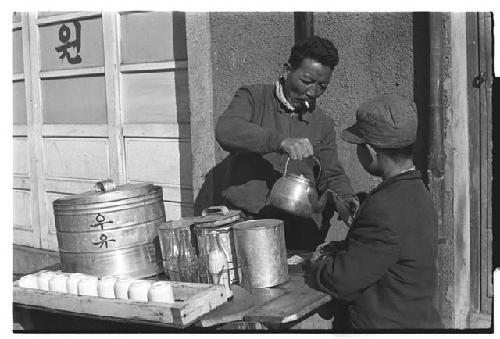 Street vendor serving tea