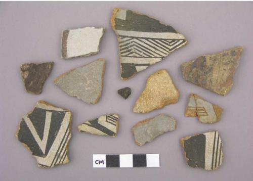 Ceramic sherds, bi- or polychrome or plain interior, some mended