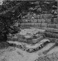 Masonry altar at base of North stairway at Structure Q162