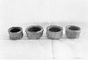 4 miniature straight-sided bowls, ring bases, excavation 1-31, grave C, level l