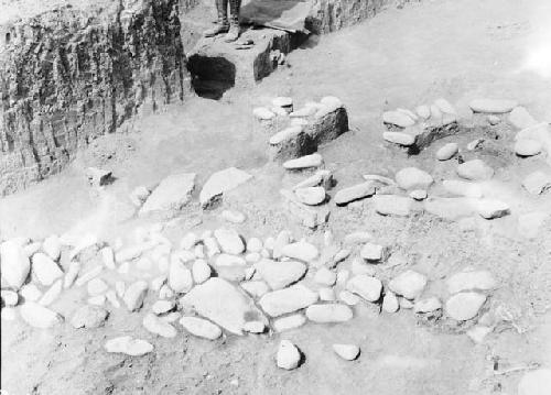 Grave excavation 3-31 showing stones in east end of trench