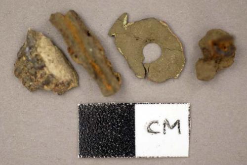 Metal, various pieces, one round with perforations