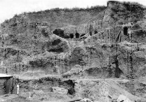 Man standing at base of east face of mound E-III-3