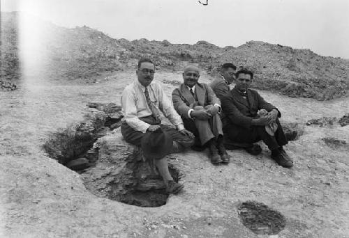 Group of men posing for picture on rock, visit of Ministry and Bohm