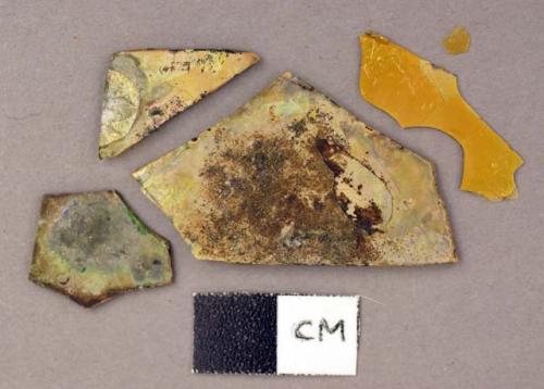 Glass, flat, yellow and brown fragments