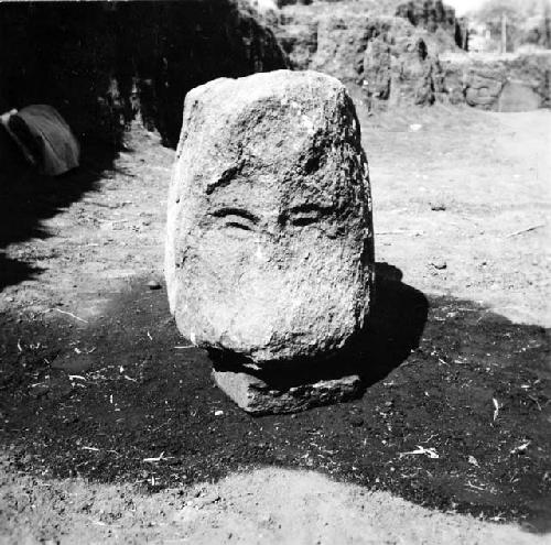 Front view of sculptured serpent head with human face in mouth