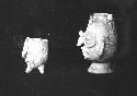 Two pottery vessels, human heads (side view).