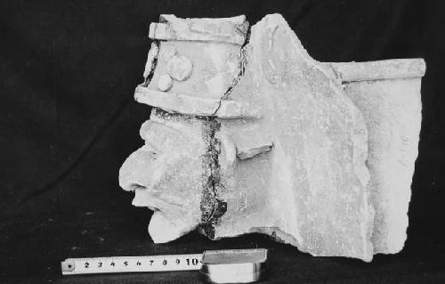 Profile view of 55-30-83.  Effigy incensario head.  Str. R-86, Burial Cist 2