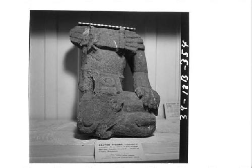 Seated stone figure from debris of Mounds 26 and 11