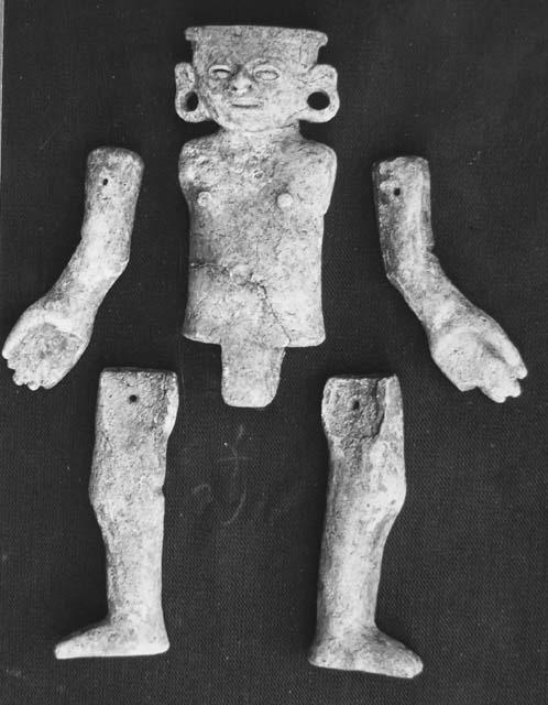 Pottery doll with articulated arms and legs