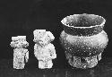 Two figurines and  pot with decorations basal phlange.