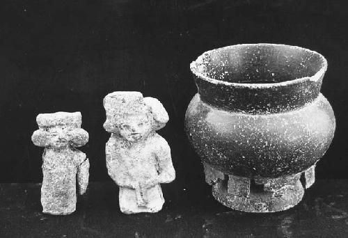 Two figurines and  pot with decorations basal phlange.