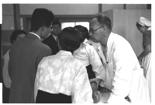 Doctor examining a woman's leg