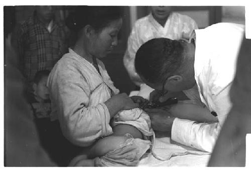 Doctor examining a child