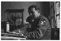 German Red Cross worker sitting at desk