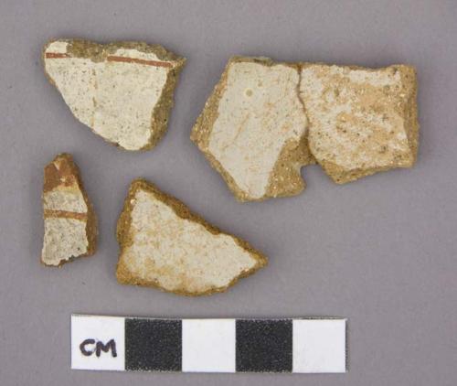 Ceramic sherds, bowl, red designs on white interior, terra cotta, one mended