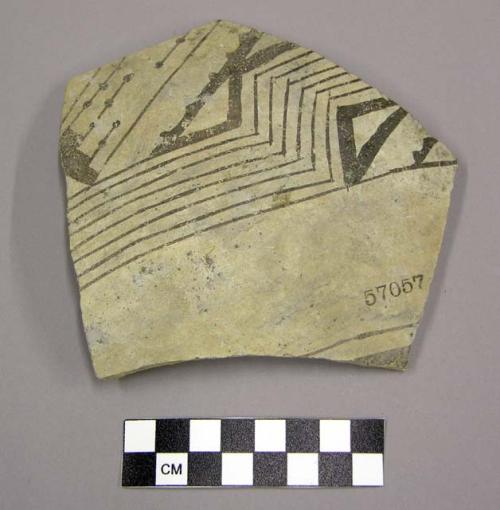 Body sherd, black linear designs on exterior, buff