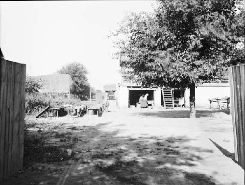 View of women sherd washing in the field house yard