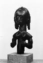 Wooden figurine frontal view, female god