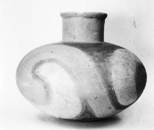 Large earthen red and white jar