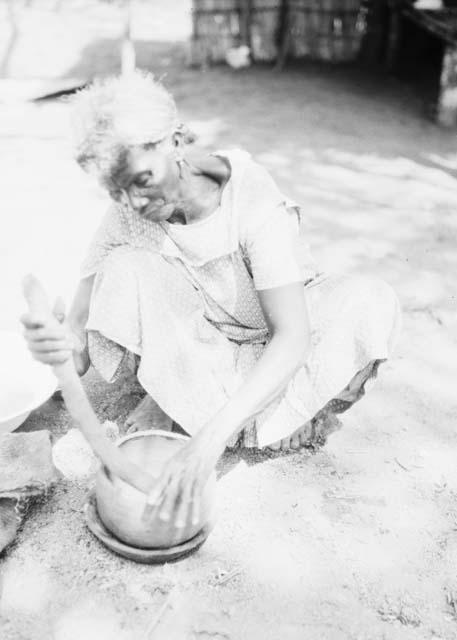 Pottery making, adding clay roll