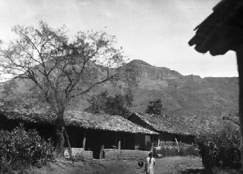 View of village homes, probably mud and brick, with corrugated roofs