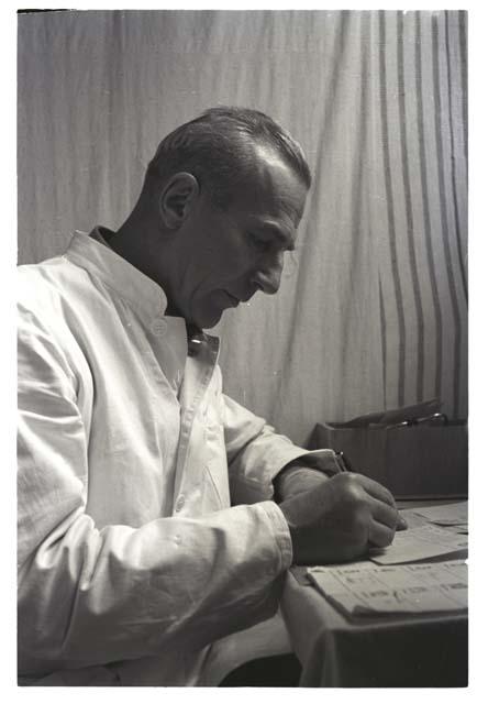 Man writing on a document