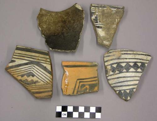 Ceramic, rim or body sherds, painted designs on four sherds, one plain