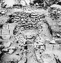 Str. Q-82 Trench through stairway, exposing early construction