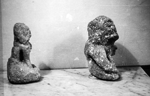 Two crude limestone figures