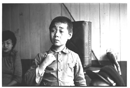 Young boy wearing Western-style collared shirt