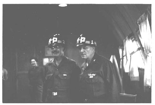 General Whitcomb and another American officer posing in military police helmets