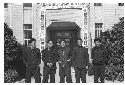 Five men in front of U.S. Information Centre, Tong Yung