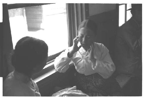 Two women near a window