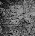 Terrace wall abutting torn out stairway south of Structure R89