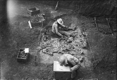 Excavation 1-31; Grave C, Level 2, showing work on grave and pit