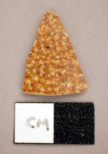 Ceramic, sherd, white base with brown speckled color