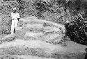 Man standing next to structure 1 of Mound E - III -3