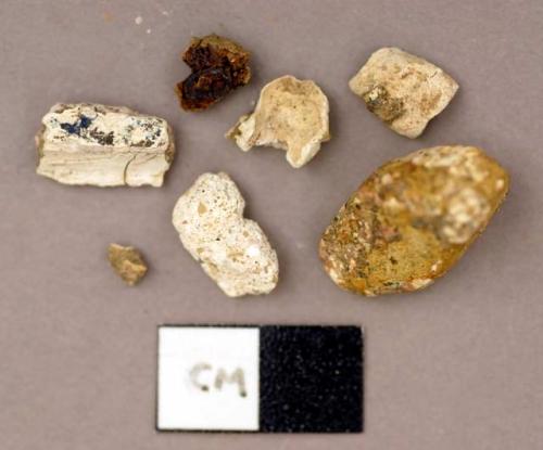 Concrete, fragments, white clumps with colored specks