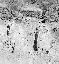 Close-up of stucco feet and bench, Structure Q-97