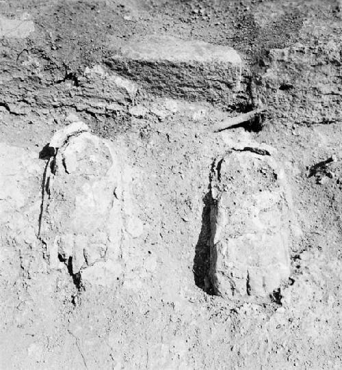 Close-up of stucco feet and bench, Structure Q-97